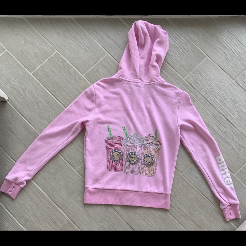 Pink Butter zip-up sweatshirt with rhinestones.